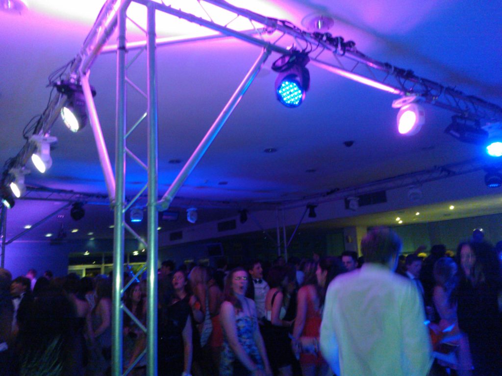Photo shows trussing rig and event lighting at Leicester City FC for Loughborough Students Athletic Union Ball. Also pictures dancers